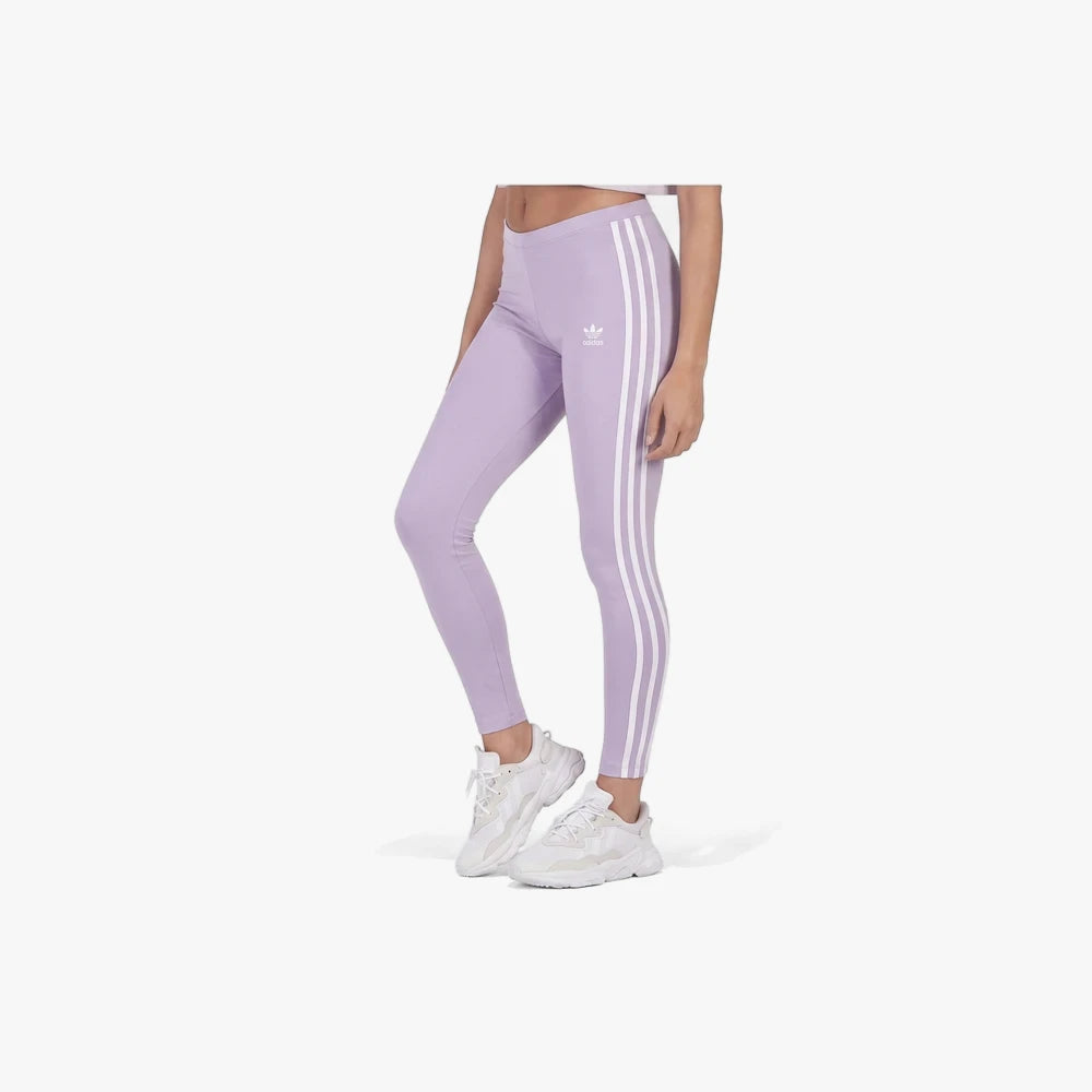 Violet purple Adidas Ladies Three Stripe Tight Leggings on a model, featuring classic white stripes down the sides.