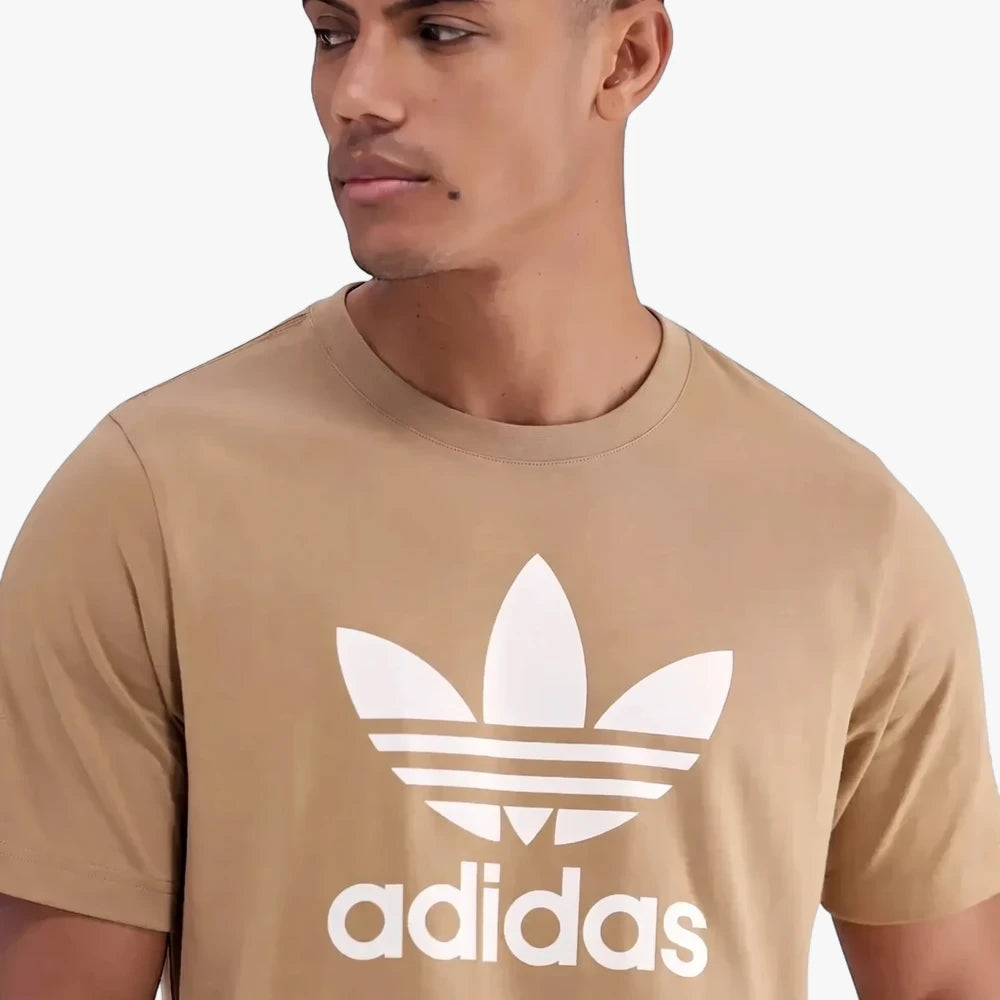 Close-up of a man wearing an Adidas Men&