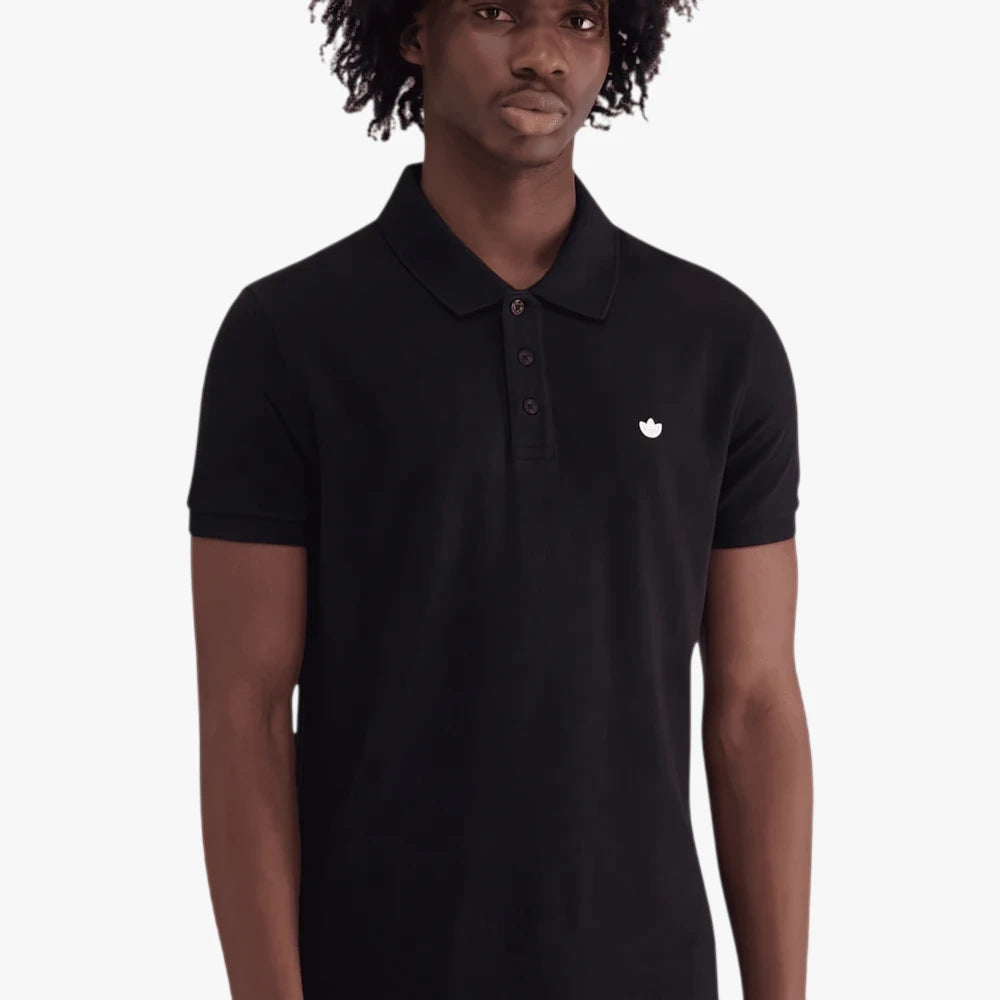 Black Adidas Mens Trefoil Essentials Polo Tee worn by a model, front view. Features a white logo on the chest and a