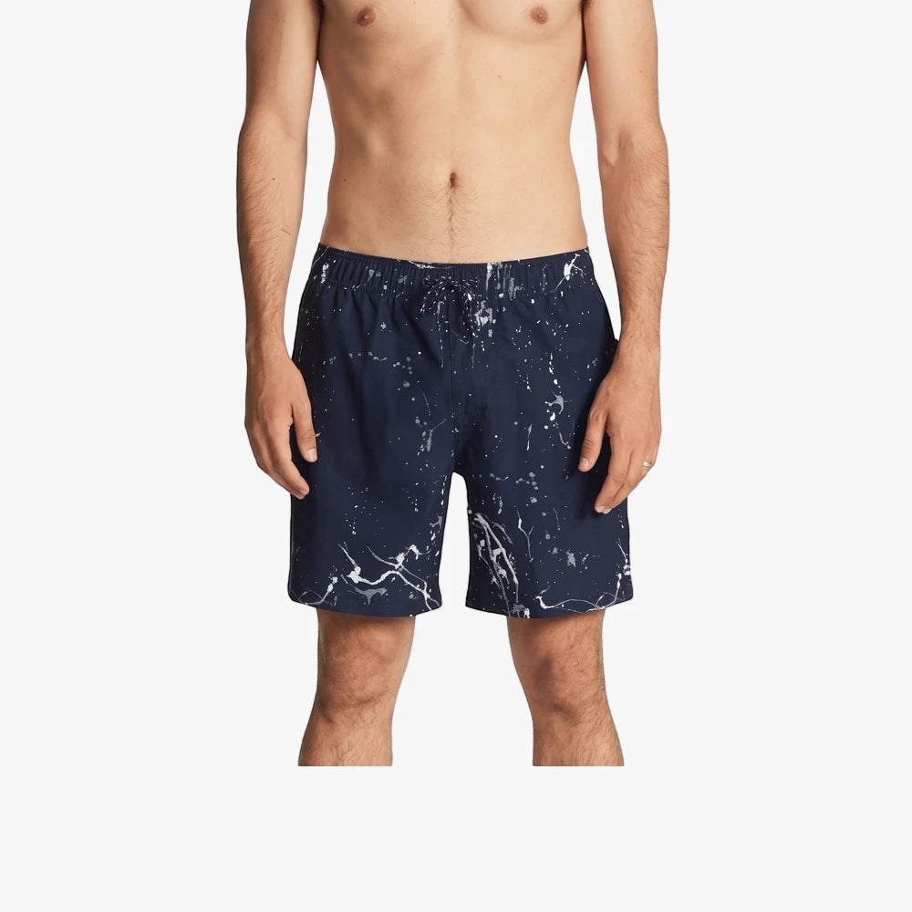 Billabong Boys Hazey Day Layback Shorts in navy with white paint splatter worn by a male model.