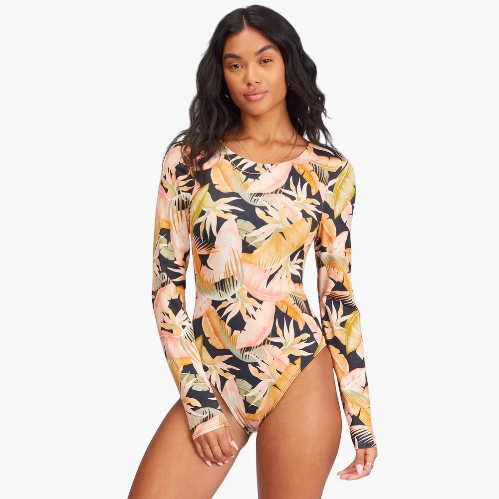 Billabong Womens Wave Tribe Long Sleeve Swimsuit in Jungle Night tropical print, featuring a black background with peach,