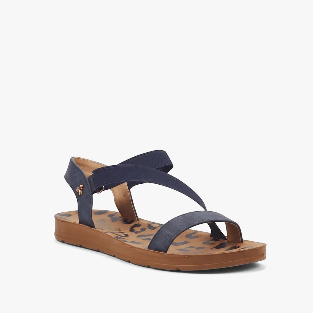 Butterfly Womens Zina 17 navy sandals featuring elastic straps, a brown sole, and a stylish leopard print footbed.