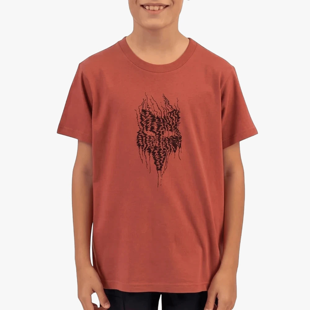 A boy models a Fox Boys Explore short sleeve tee in dark slate with a unique black graphic print.