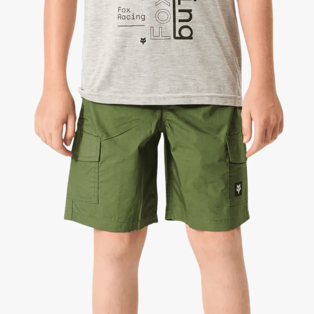 Fox Boys Mini Slambozo cargo shorts in hunter green, featuring side flap pockets and a subtle brand logo, worn by a child.