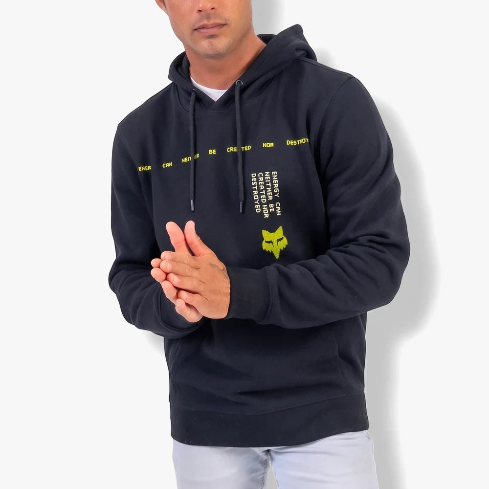 Front view of a male model wearing a black Fox Mens Throttle Oversized Pullover hoodie with yellow branding and