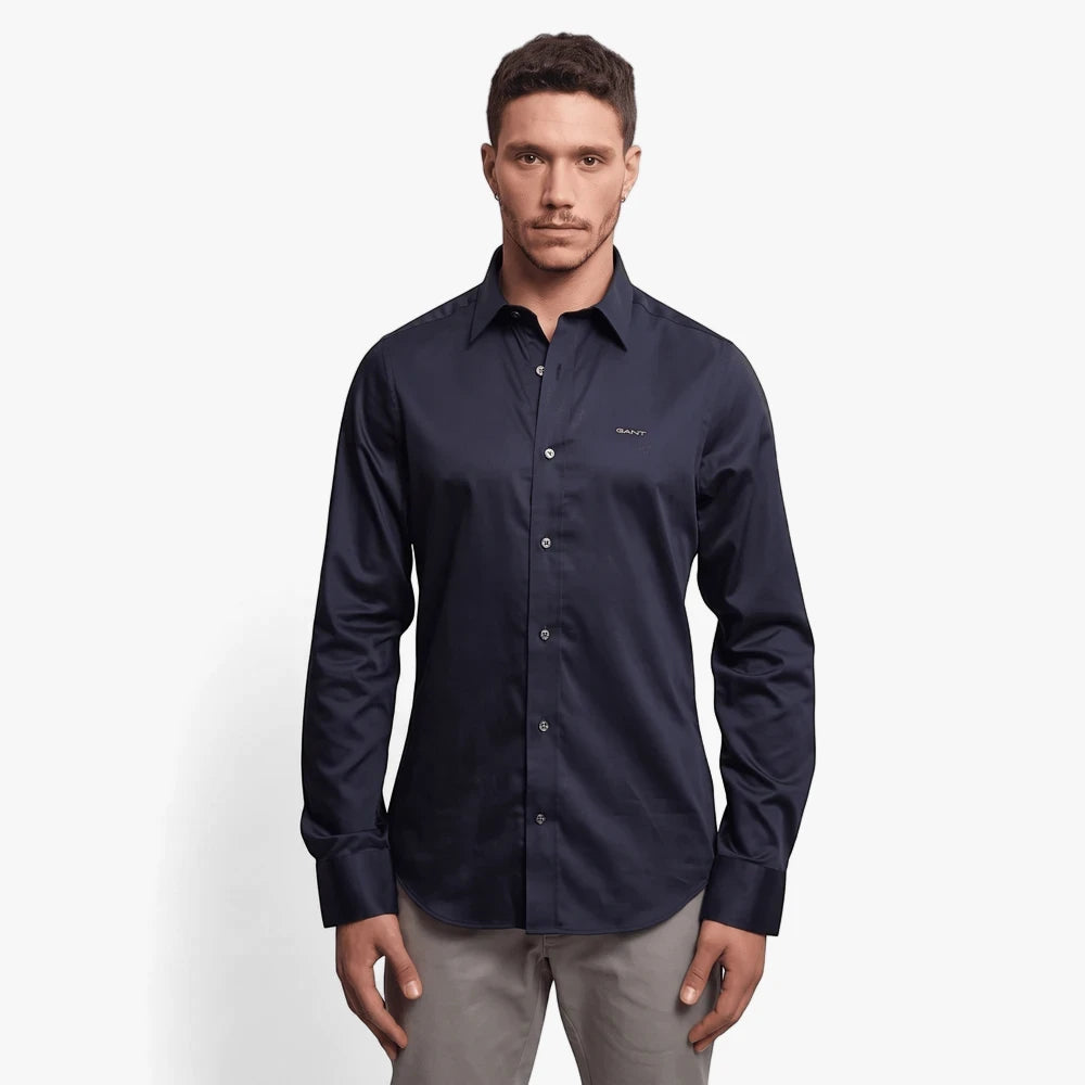 Gant Mens Slim Sateen Long Sleeve Shirt in dark blue, worn by a male model, showcasing its smooth fabric and fit.