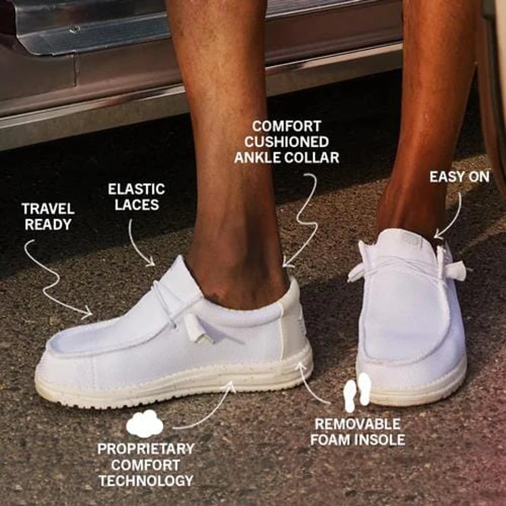 Hey Dude Mens Wally Stretch Sox White slip-on shoes featuring cushioned ankle collar, foam insole, and elastic laces