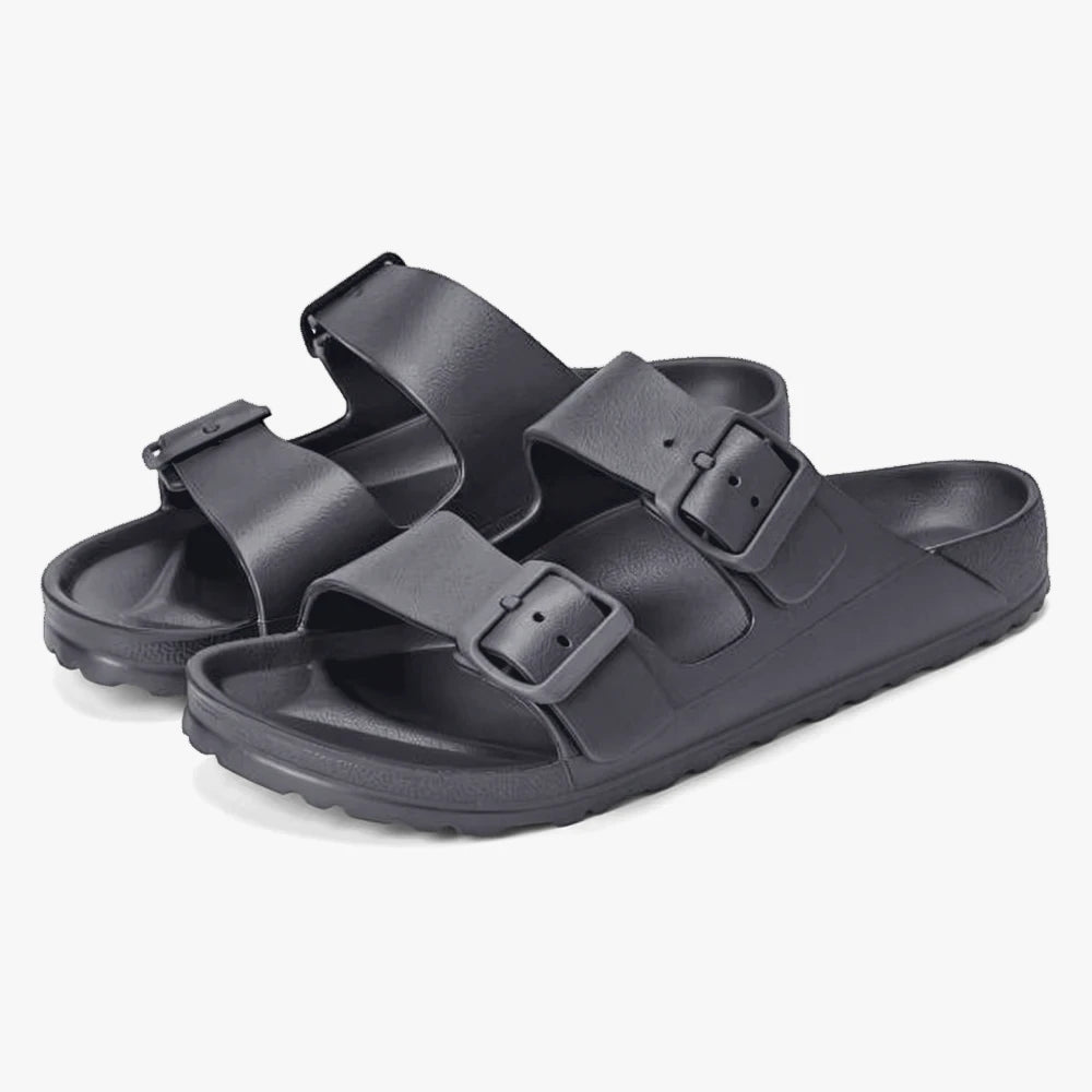 A pair of dark grey Hoster Womens Sundreamer Sandals with two adjustable buckle straps, seen from a slightly elevated view.