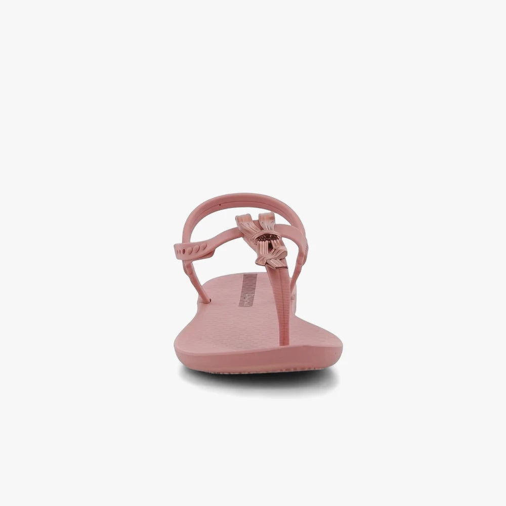 A single pink Ipanema Womens Class Charming Sandal with a delicate bow detail on the thong strap and an adjustable ankle