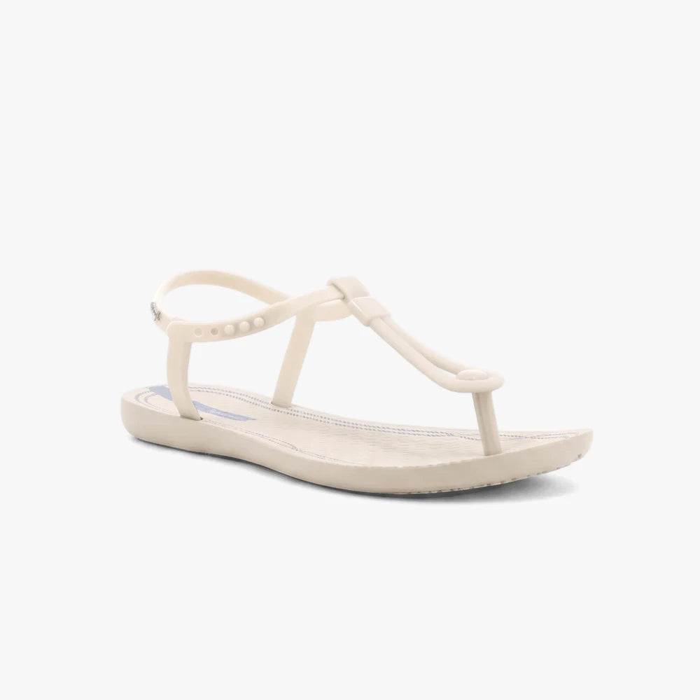 Ipanema Womens Class Slim T-strap sandal in beige with a subtle blue sole detail, presented from a side view.