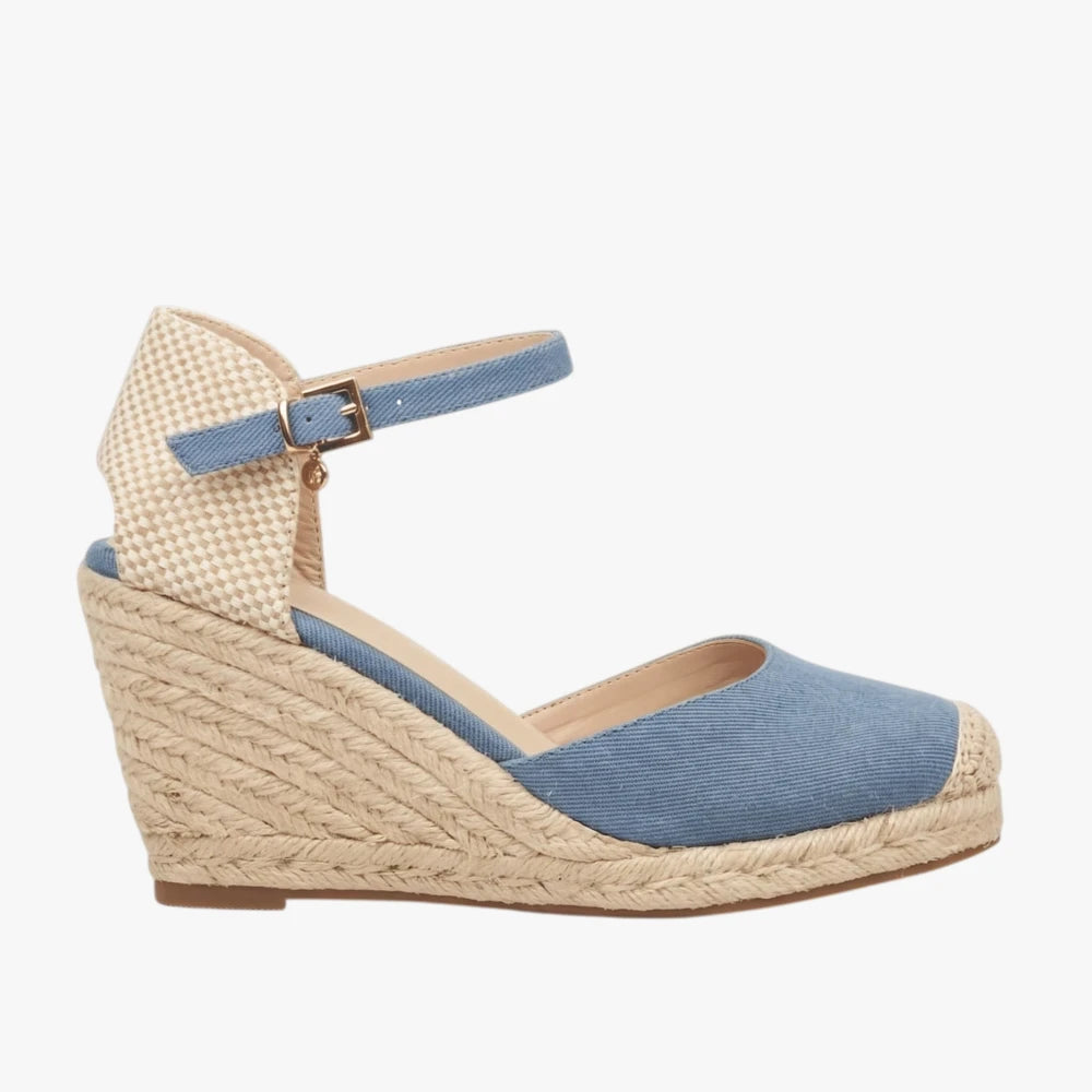 Blue denim espadrille wedge sandal with an ankle strap and woven sole, shown in a side view.