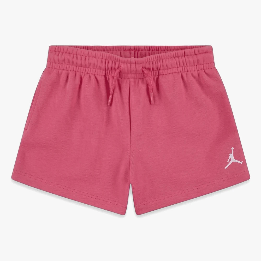 Fire pink Nike Girls Jdg Brooklyn Essentials Shorts with an elastic waistband, drawstring, and white Jumpman logo. Laid flat.