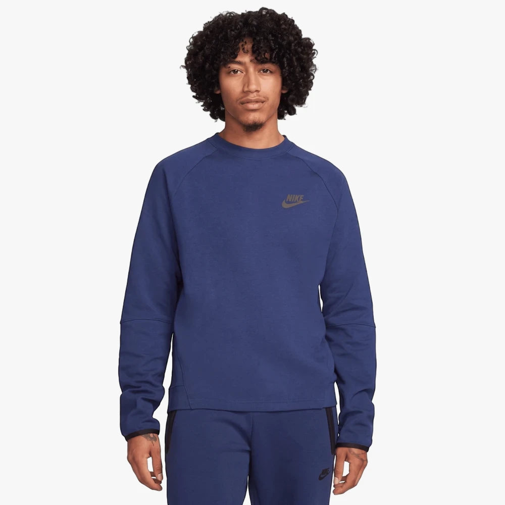 A male model wears a dark blue Nike Men&