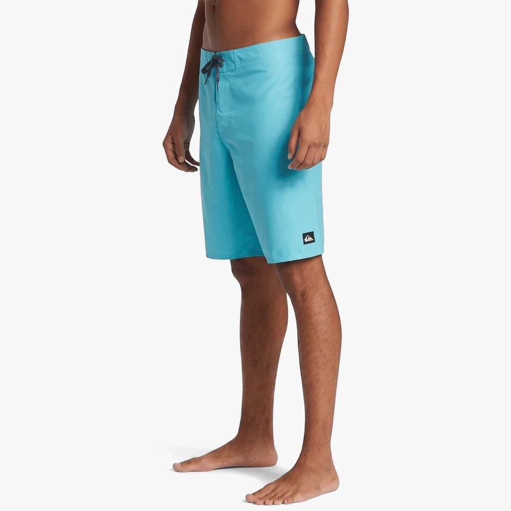Maui blue Quiksilver Everyday Solid 20" Volley Shorts on a male model, side view, showing drawstring and brand logo.