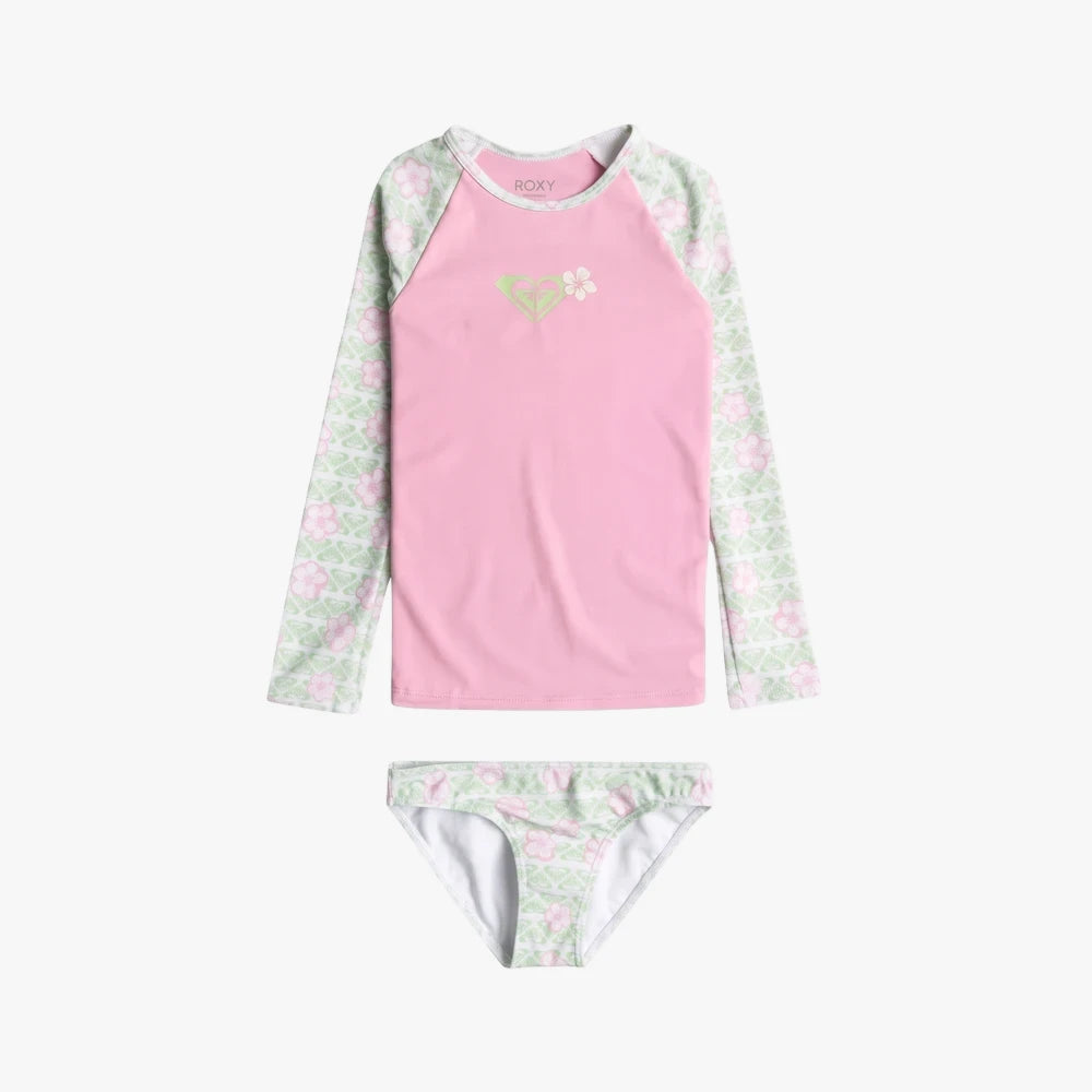 Roxy Girls Hibiline two-piece long sleeve Lycra set in white and pink with a patterned design, laid flat.