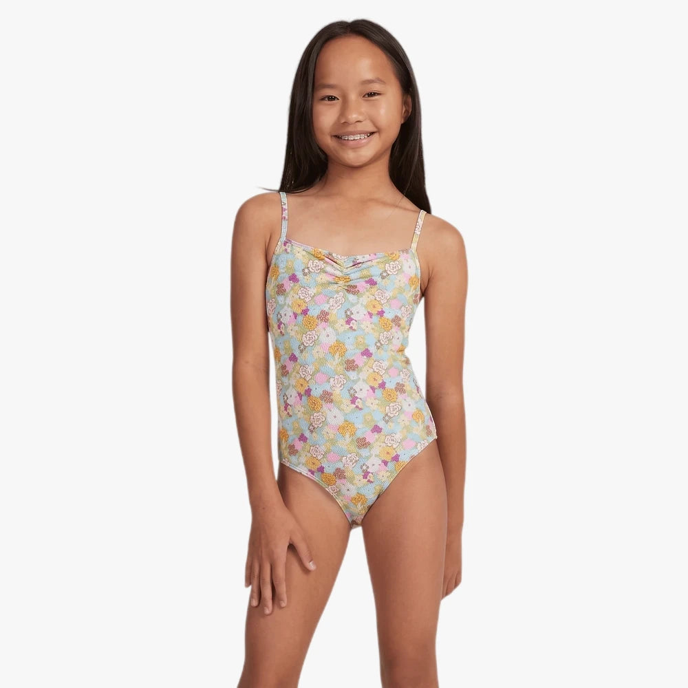 Roxy Girls Nostalgic Seaside one-piece swimsuit in a multi-color floral print on a light blue ribbed fabric, front view.