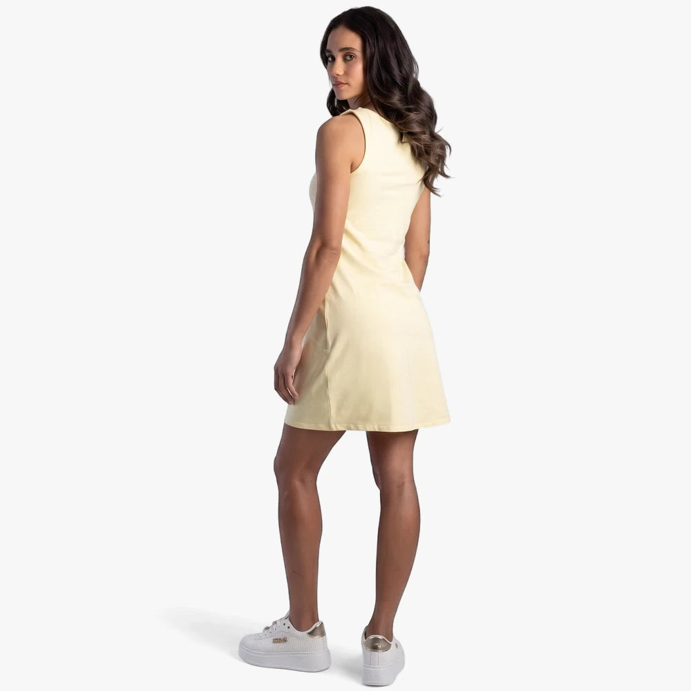 Pale yellow Sissy Boy Boat Neck Mini Dress Bling Logo, sleeveless, shown on a woman from a back view looking over her