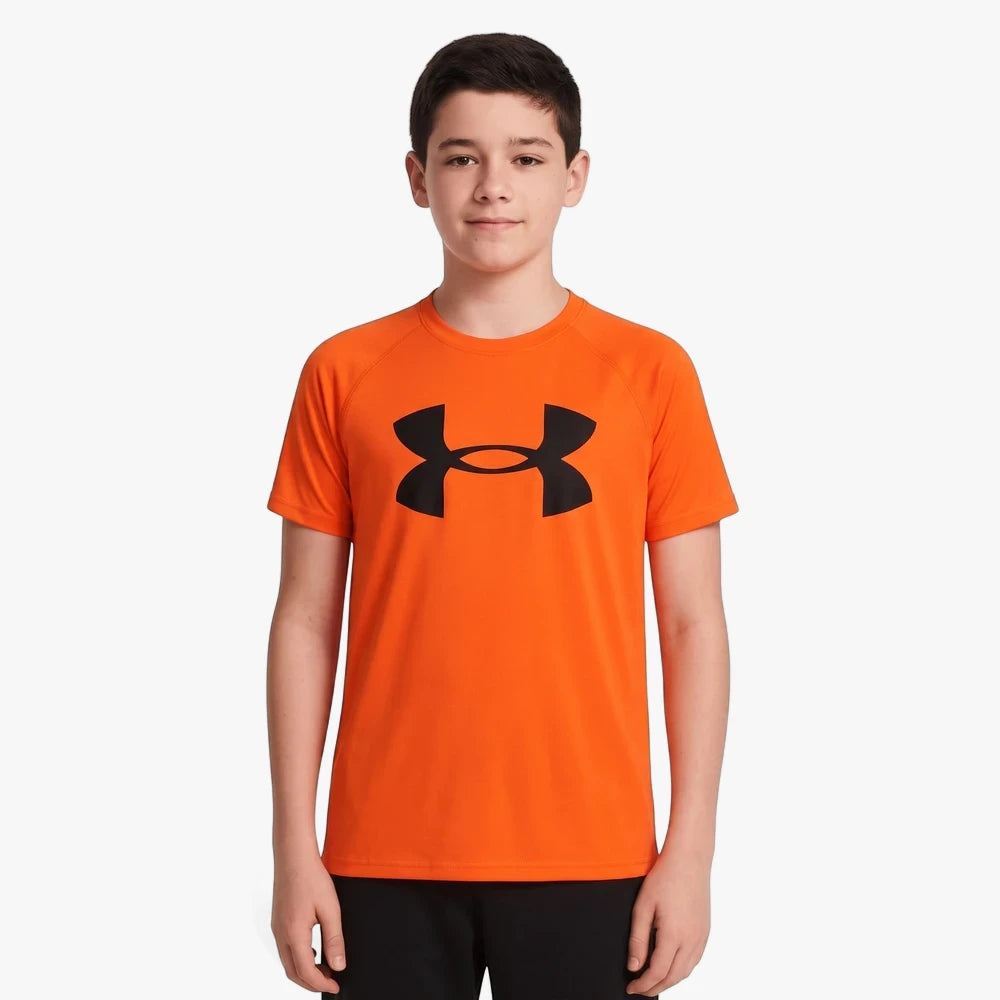 Under Armour Boys Tech Big Logo Short Sleeve Tee in 847 Fire, featuring a bold black logo on an orange shirt.