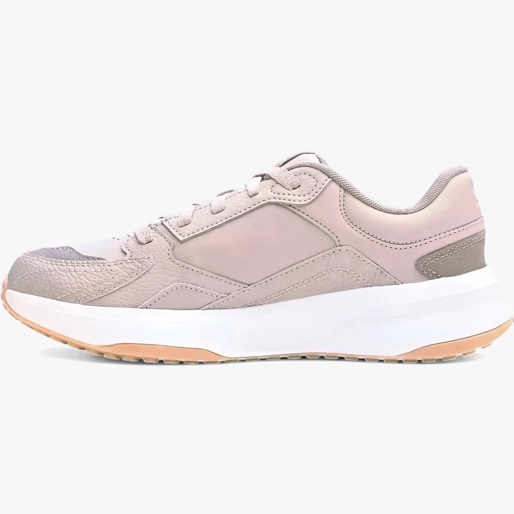 Under Armour Mens Edge Leather Sneaker 203 in beige, featuring a side profile view of the shoe, thick white sole, and