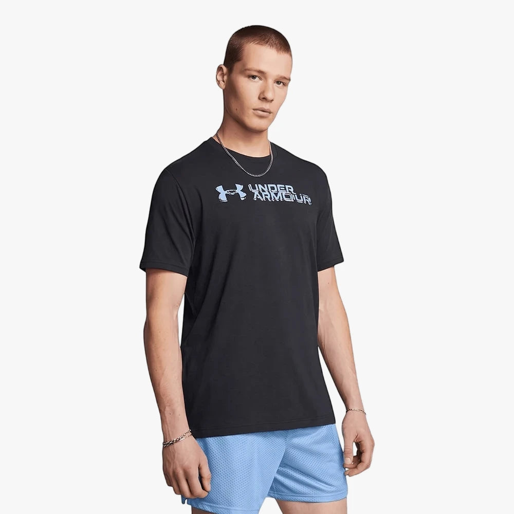 Black Under Armour Mens Sliced Wordmark Short Sleeve Tee and blue shorts on a male model.