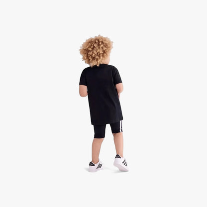 Adidas Boys Youth Ess Short Sleeve Tee Black. A young boy from behind, wearing a black t-shirt and black striped shorts,
