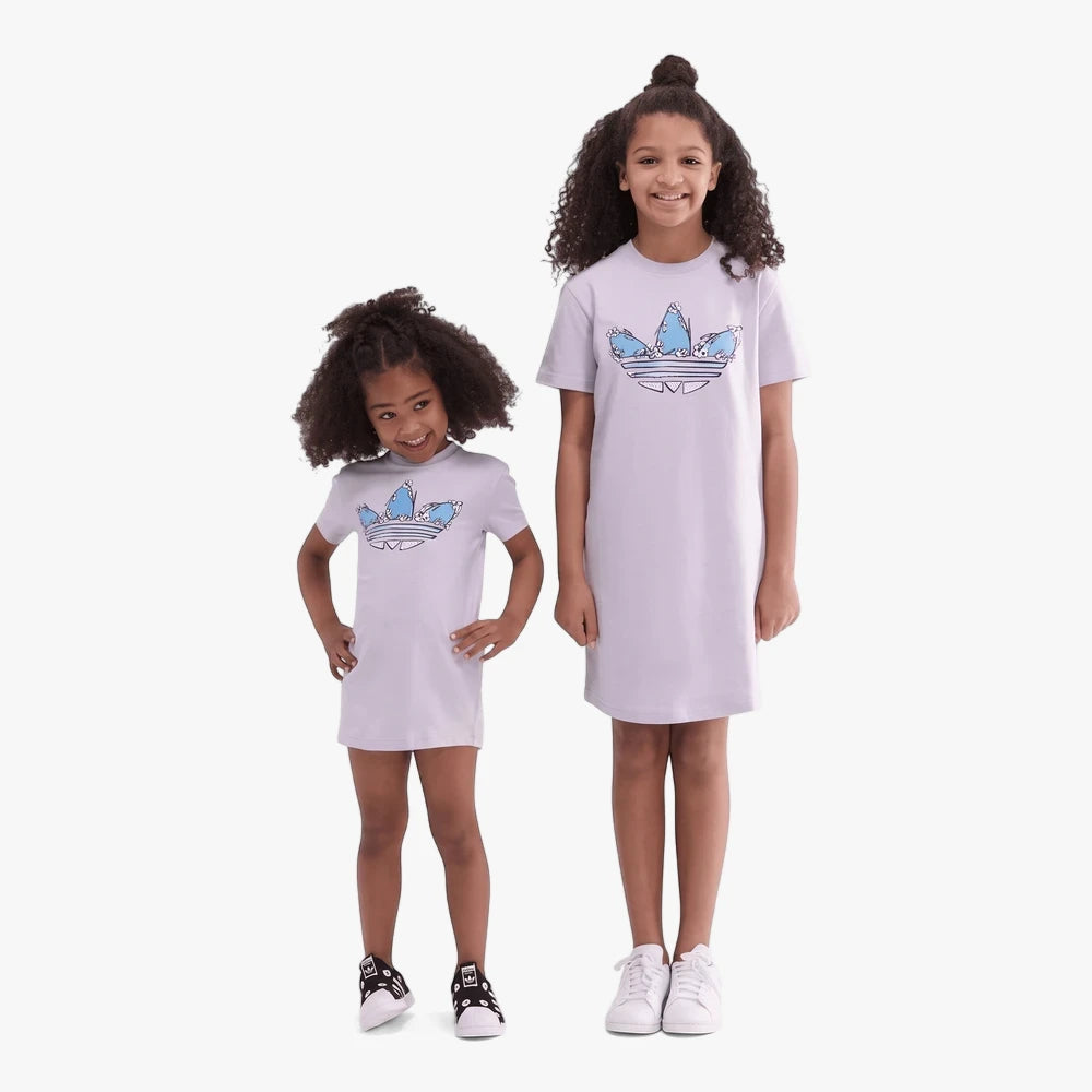 Two girls in full body shot wearing Adidas Girls Summer Dresses in Silver Dawn with blue Trefoil logo.