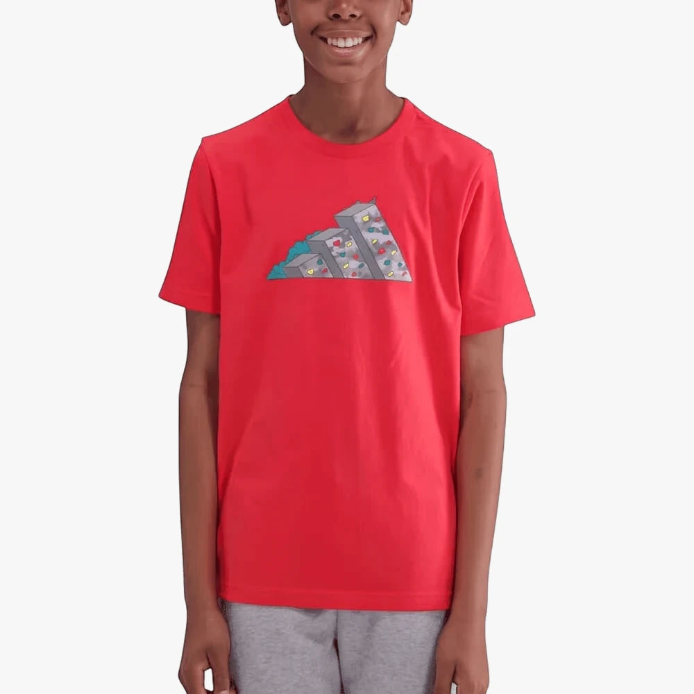 Adidas Kids Camo 2 Short Sleeve Tee in red worn by a boy, featuring a grey, blue, yellow, and red climbing wall graphic.