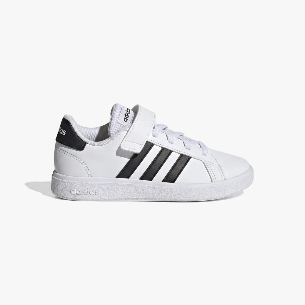 Adidas Kids Grand Court 2.0 El sneaker in white with black stripes, white laces, and a velcro strap, viewed from the side.