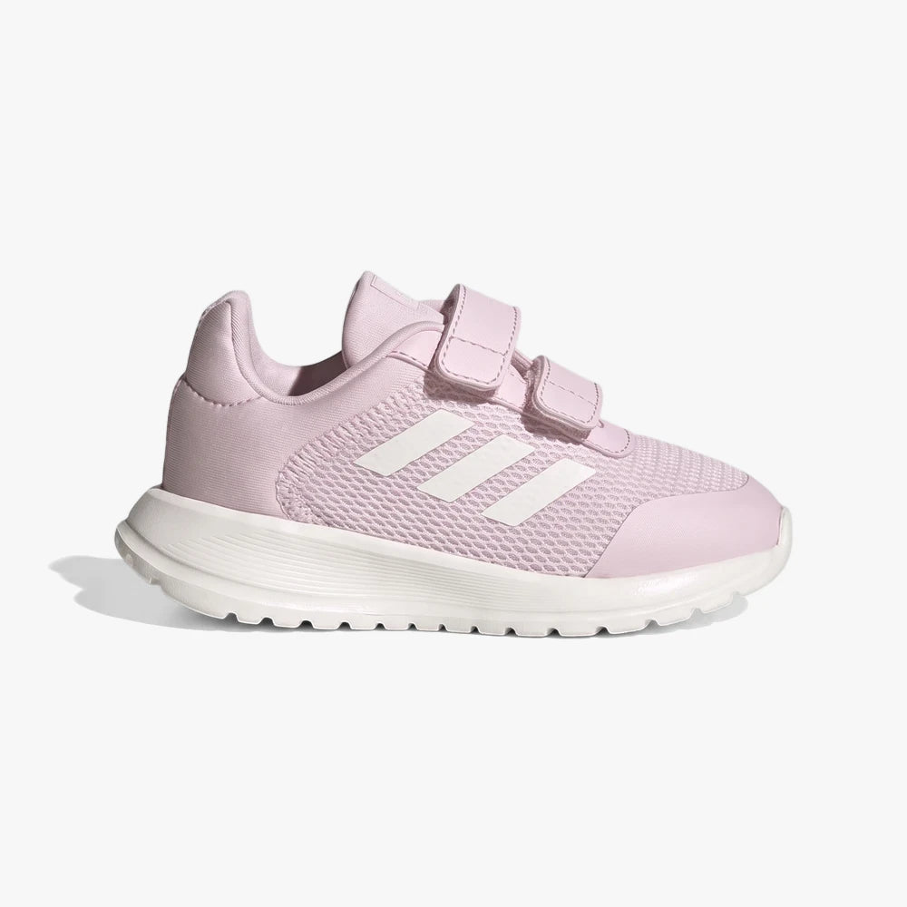 Side view of a pink Adidas Kids Tensaur Run 2.0 sneaker featuring white three stripes and two adjustable velcro straps.