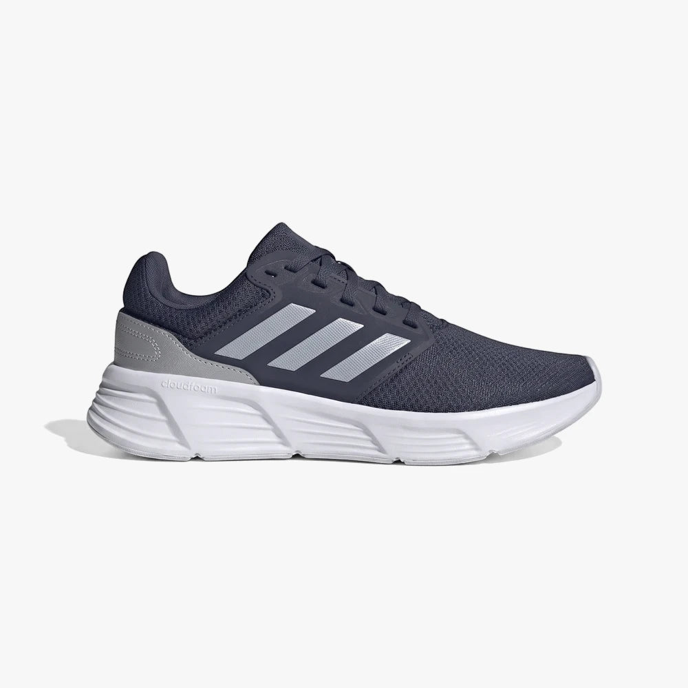 Adidas Mens Galaxy 6 Training Sneaker in Wonder Blue, featuring a dark blue mesh upper, silver stripes, and a white