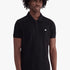 Black Adidas Mens Trefoil Essentials Polo Tee worn by a model, front view. Features a white logo on the chest and a