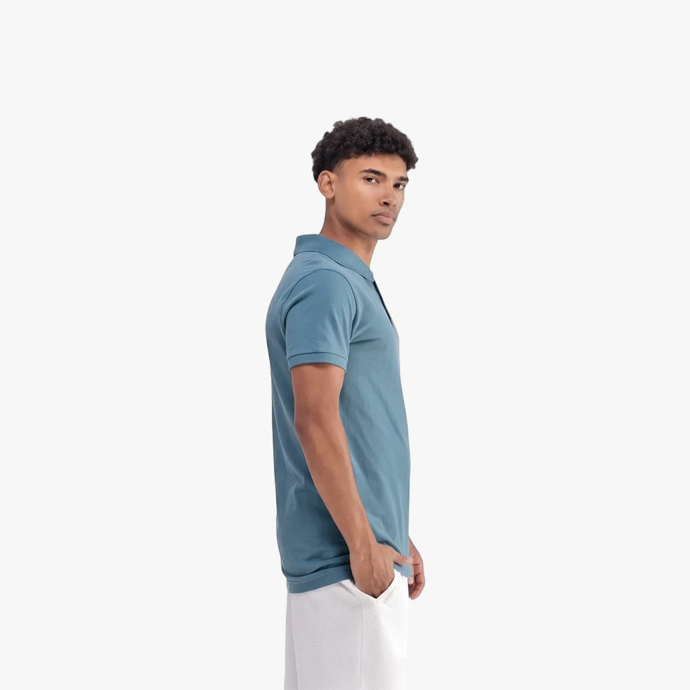 Male model wearing a teal/blue Adidas Men&