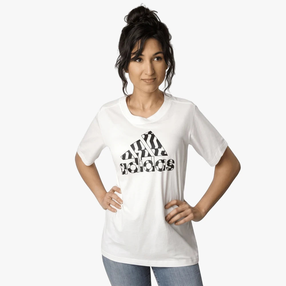 Adidas Womens Zebra Short Sleeve Tee in white, worn by a woman, featuring a distinctive zebra stripe and soccer ball pattern