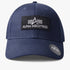 Alpha Industries Bedge Peak Cap in navy featuring a black embroidered patch with logo, curved brim and adjustable fit