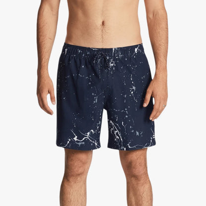 Front view of a male model wearing Billabong Boys Hazey Day Layback Shorts in navy with white paint splatter print.