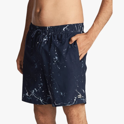 Billabong Boys Hazey Day Layback Shorts in navy with white splatter print worn by a model, featuring an elastic waist and