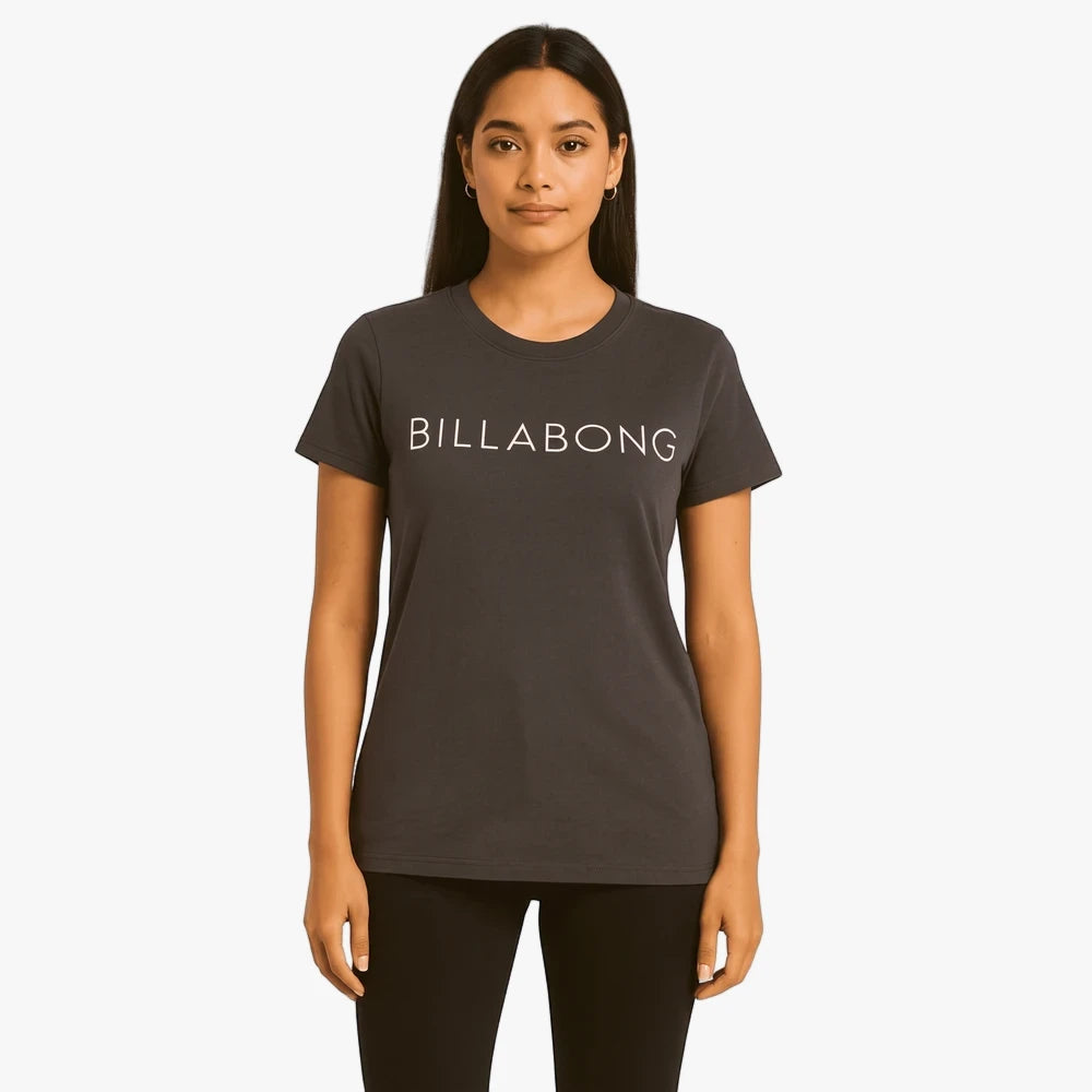 Billabong Womens Long Island Short Sleeve Tee in off black, modeled by a woman wearing black pants, front view.