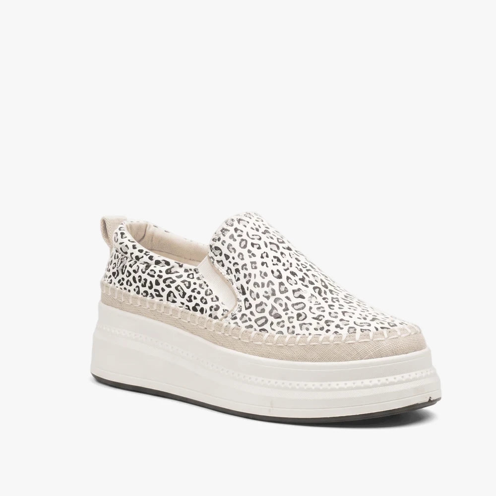 Butterfly Womens Senhora 13 slip-on platform sneaker in white with black leopard print and beige espadrille trim, side view.
