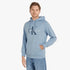 Male model in a light blue Calvin Klein Monogram Hoodie featuring a prominent &