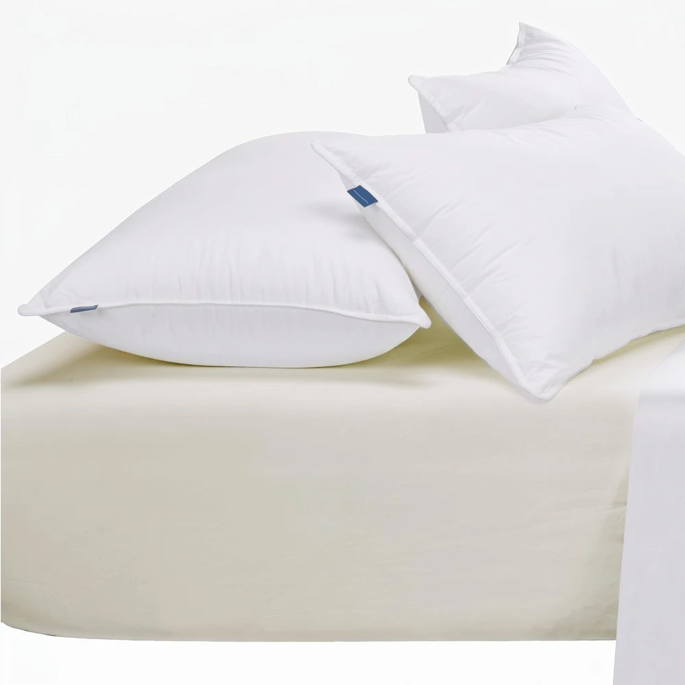 Cream Cotton Co 400 thread count Queen extra fitted sheet with two white pillows, for comfortable bedding.