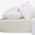 Cream Cotton Co 400 thread count Queen extra fitted sheet with two white pillows, for comfortable bedding.