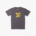 Dc Boys Peel It Photo Short Sleeve Tee in magnet grey. Features a unique yellow and black graphic logo depicting a skater,