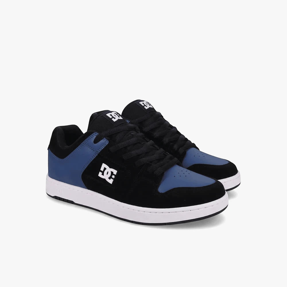 Pair of Dc Mens Manteca 4 Sneakers in black, blue, and white, featuring black laces and visible DC logos, viewed from the