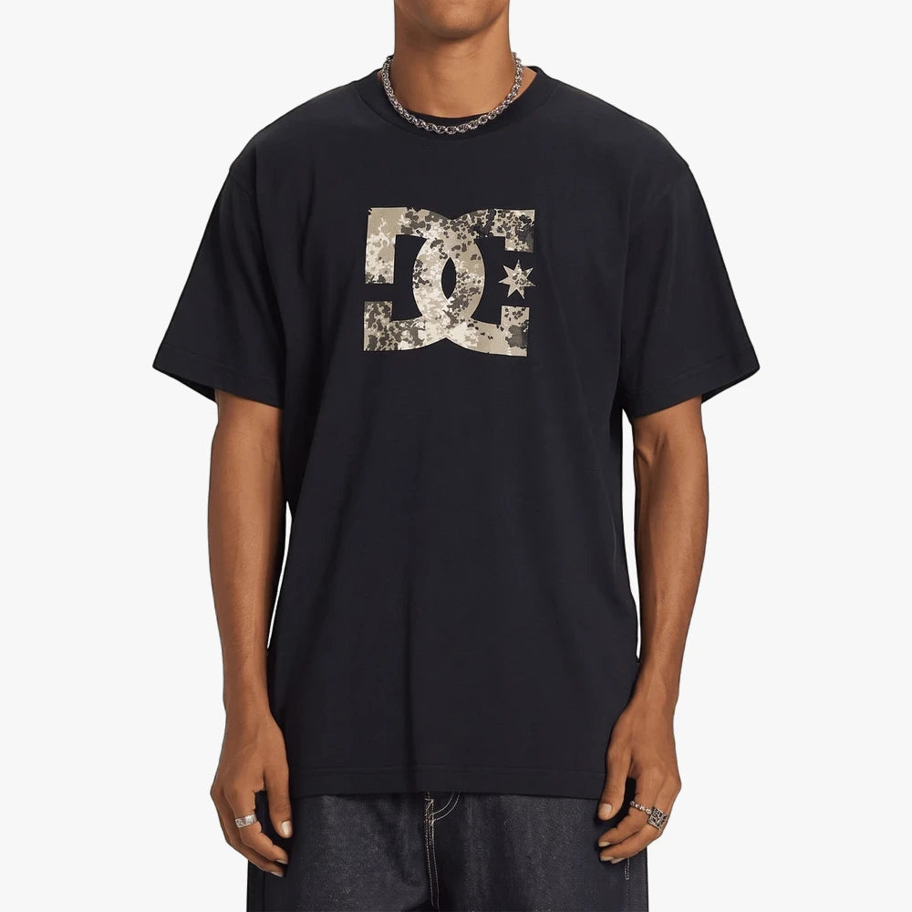 Dc Mens Star Fill Hss Short Sleeve Tee in black, featuring a camouflage-patterned DC logo, worn by a model.