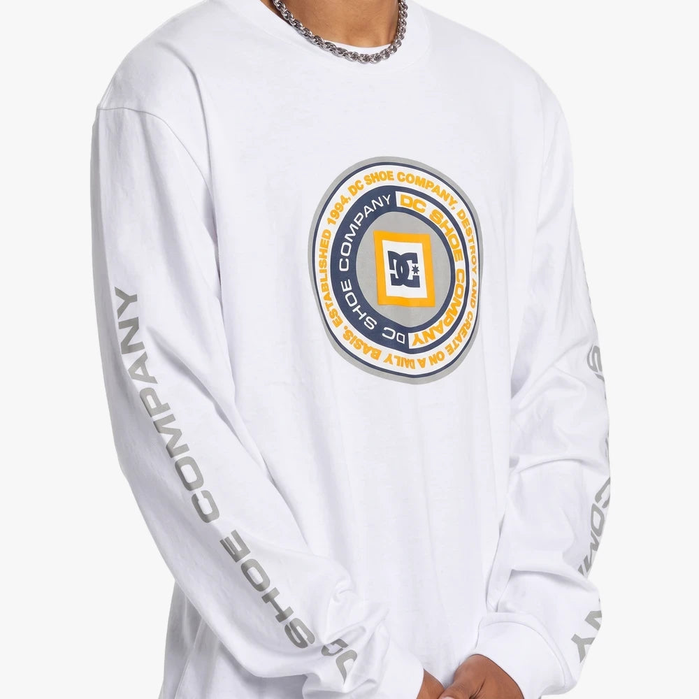 White Dc Mens Throwback Long Sleeve Tee featuring a large circular chest logo and gray branding on the sleeves, worn by a