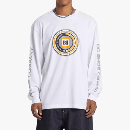 Dc Mens Throwback Long Sleeve Tee in white with a circular brand logo on the chest and text on the sleeves, worn by a model.