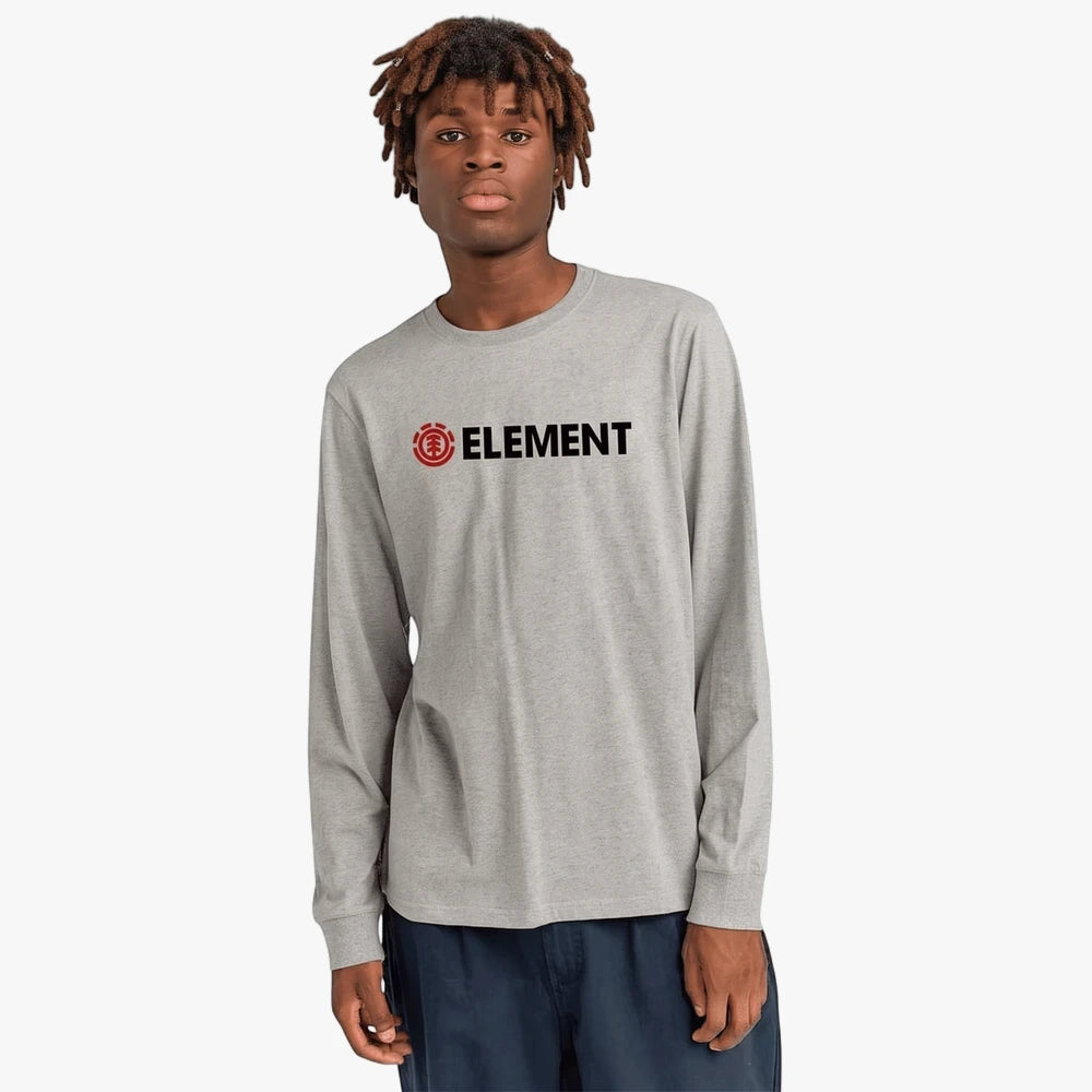 Young man wearing a grey Element Blazin long sleeve tee with a red and black Element logo, standing facing forward.