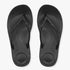 A top-down view of a pair of black Fit Flop I Qushion Sparkle Sandals with glittering rhinestone straps on the vamps.