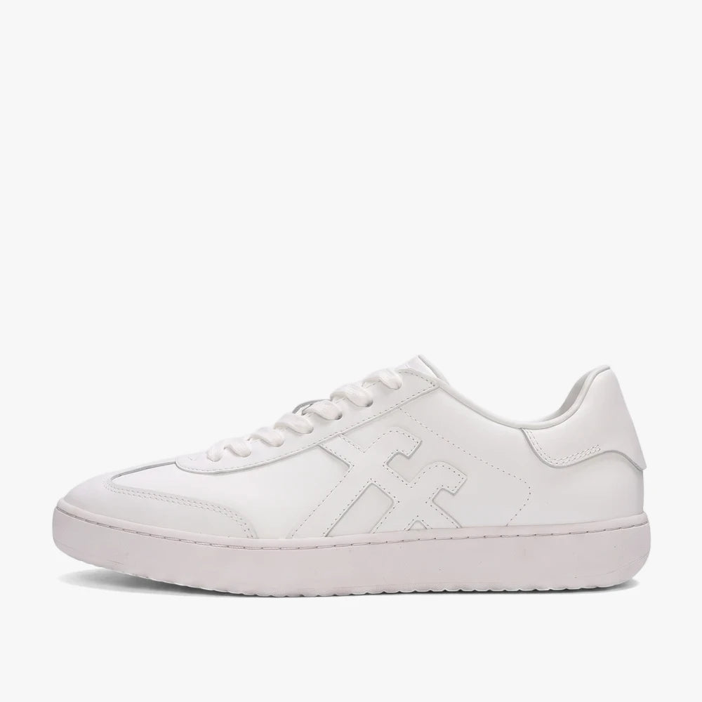 Fit Flop Mens Dash Ff Sneaker in urban white, shown from a side view, featuring a sleek leather design.