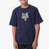A young boy models a navy Fox boys barbed short sleeve tee featuring a distinctive yellow and gray fox head logo.